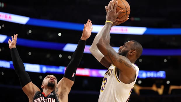 Lakers forward LeBron James (23) shoots over Houston Rockets forward Dillon Brooks (9) during the second quarter at Crypto.com Arena